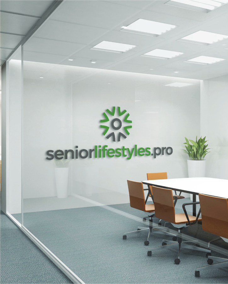 Office space with the Senior Lifestyles Pro logo on the wall